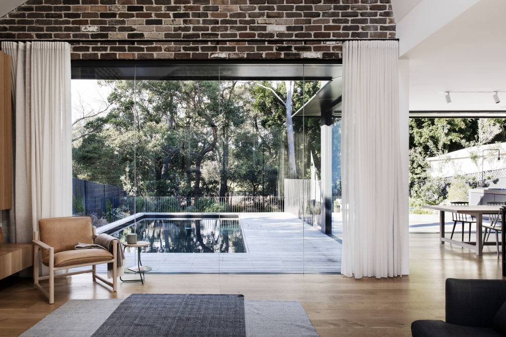 Blackened timber and recycled red brick feature throughout the renovation. Photo: Chris Warnes