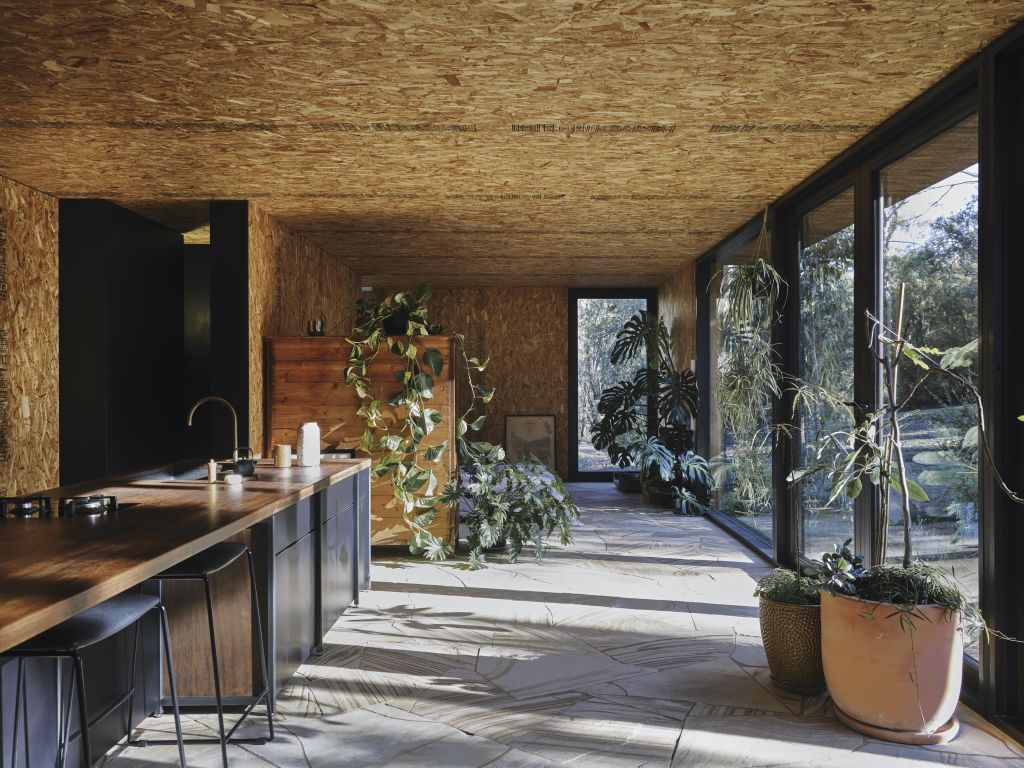 In what is essentially a one-room moveable house, sandstone flooring implies greater permanence. Photo: Adam Gibson