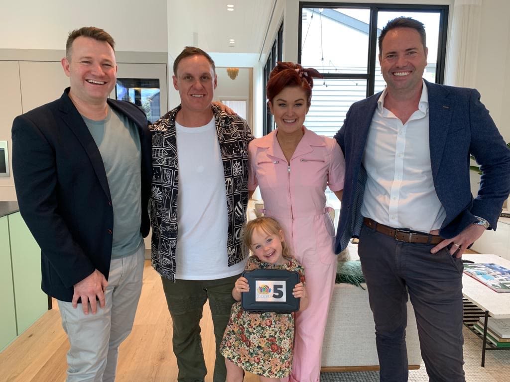 McGrath agent Michael Townsend (far right), with fellow agent Josh Stirling (far left) with The Block winners Jimmy, Tam and their daughter Frankie.