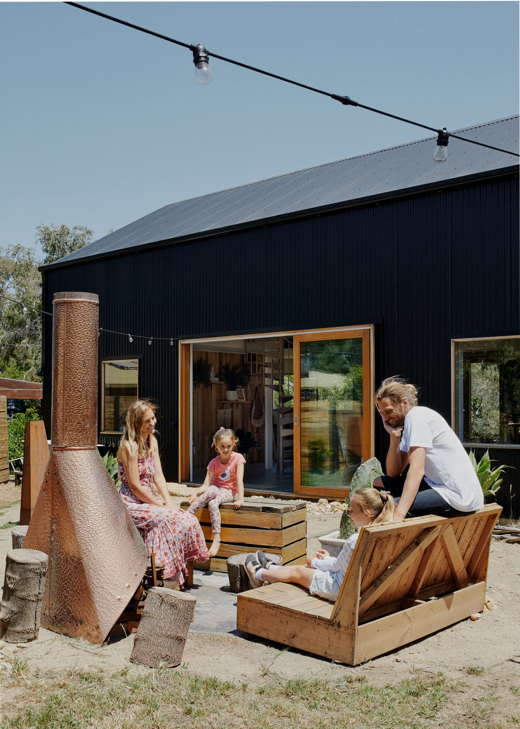 Rhys and Claire Uhlich and their daughters at their new 'Shed House' on Phillip Island, Victoria. Photo: Amelia Stanwix