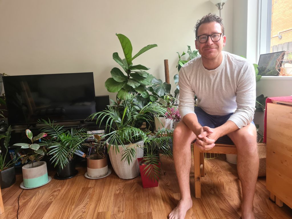 Simon Dormer grows plenty of fruit and veg in the courtyard of his ground-floor one-bedroom unit. Photo: Supplied