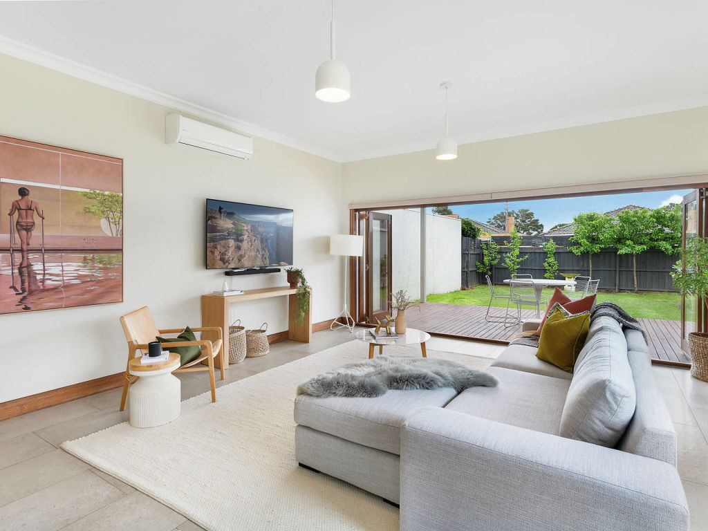 Living spills open to a generous deck at 38 Collins Street in Geelong West. Photo: McGrath