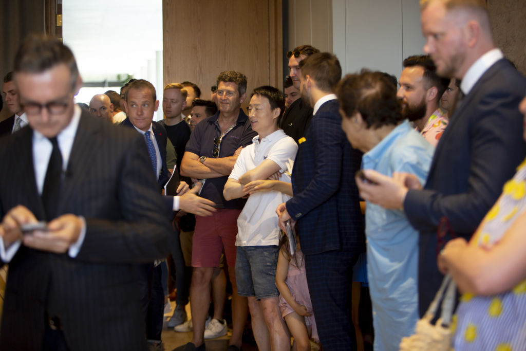 Prospective buyers at Ray White's boardroom auction in the Calile Hotel in Fortitude Valley. Photo: Tammy Law