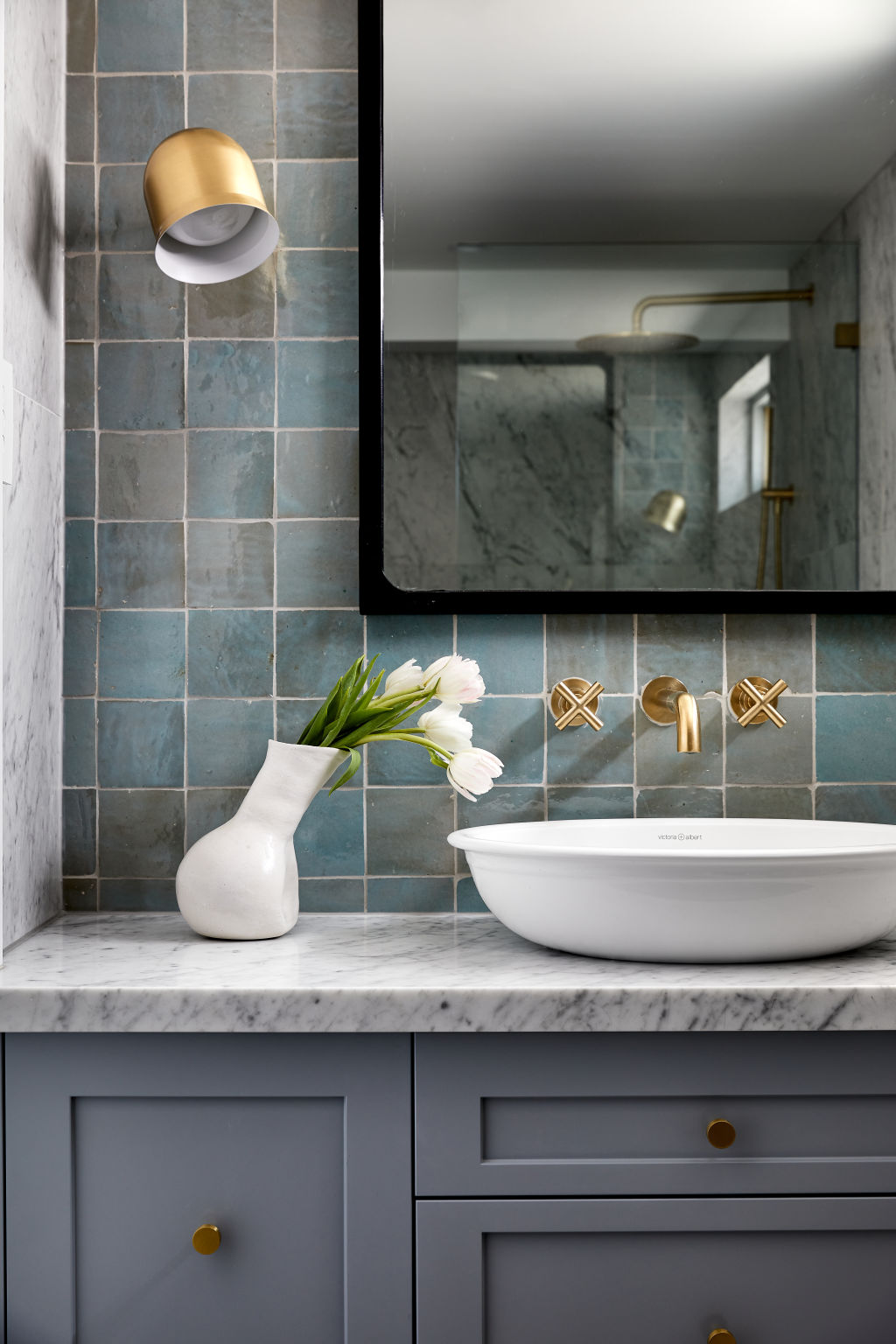 For a small bathroom, opt for a slim modern profile with deep under shelf drawers. Photo: Harper Lane Design/Ryan Linnegar