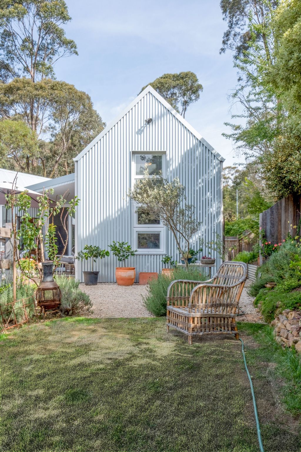 This sweet house has tall windows which are perfectly proportioned but really there for privacy. Photo: Joshua Macaraeg