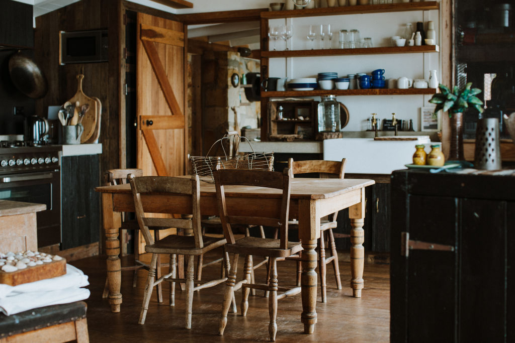 Warm and inviting: The kitchen and dining area at The Little Black Shack. Photo: Luisa Brimble