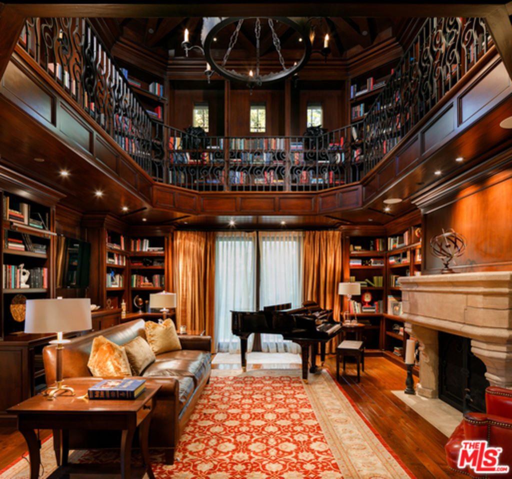 It features a stunning two-level library. Photo: Compass