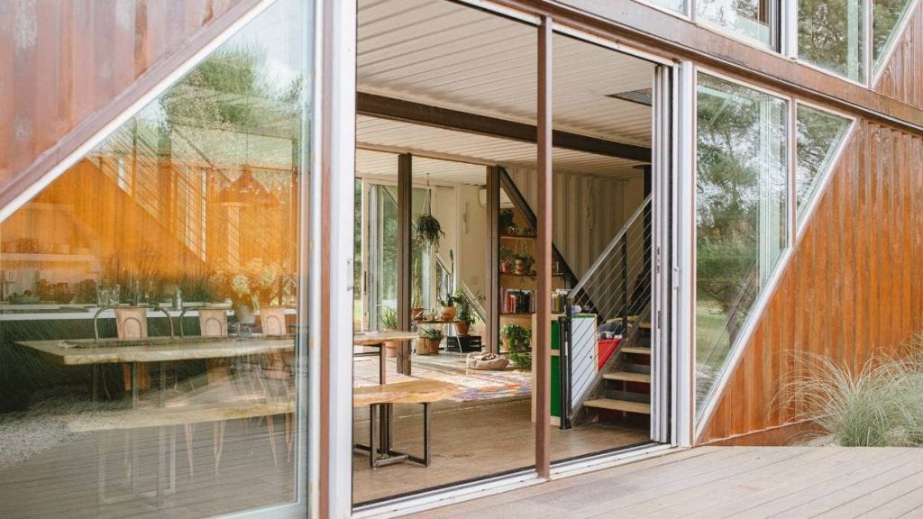 Sliding doors on both sides provide an easy flow to the outdoors, and help to ventilate the interior. Photo: Aundre Larrow/Stuff