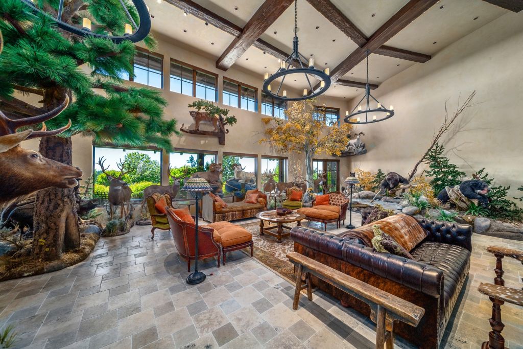 Stuffed animals, fake trees and a fake pond, create a unique living room space. Photo: Zillow/Cascade Sotheby's International Realty