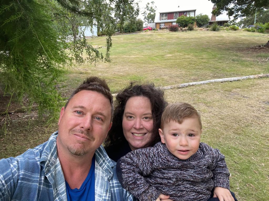 Stephanie Gammage with her husband Jason and their son Jesse at their new home in Tasmania. Photo: Supplied