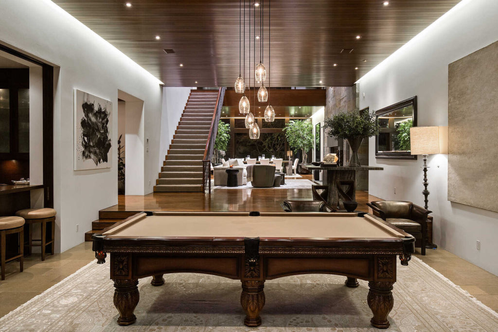 The home features warm woods and natural stone. Photo: Eric Haskell Group
