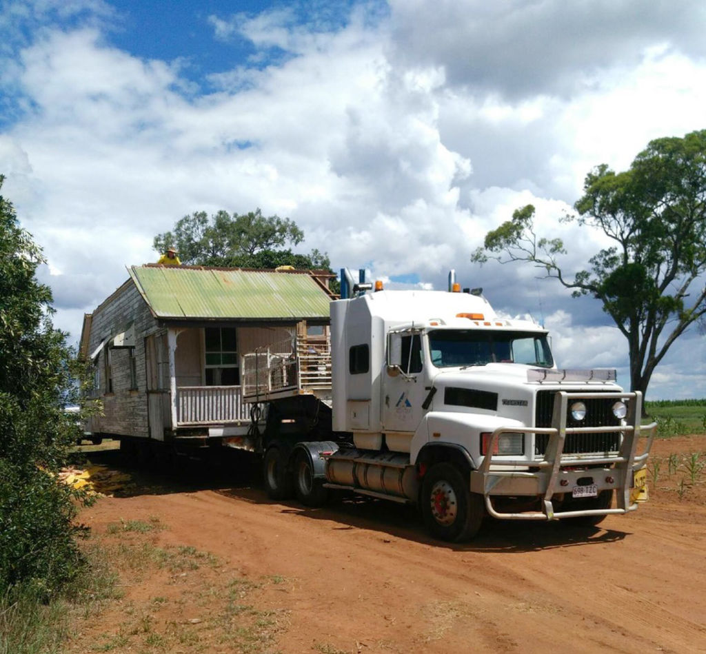 The dilapidated house was transported 300 kilometres to its new home. Photo: Supplied