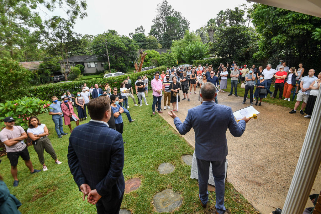 Bigger crowds are turning up to auctions as there are fewer homes for sale. Photo: Peter Rae