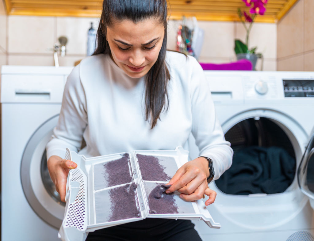 Clean out the lint trap regularly to improve efficiency. Photo: AquaArts studio (iStock)