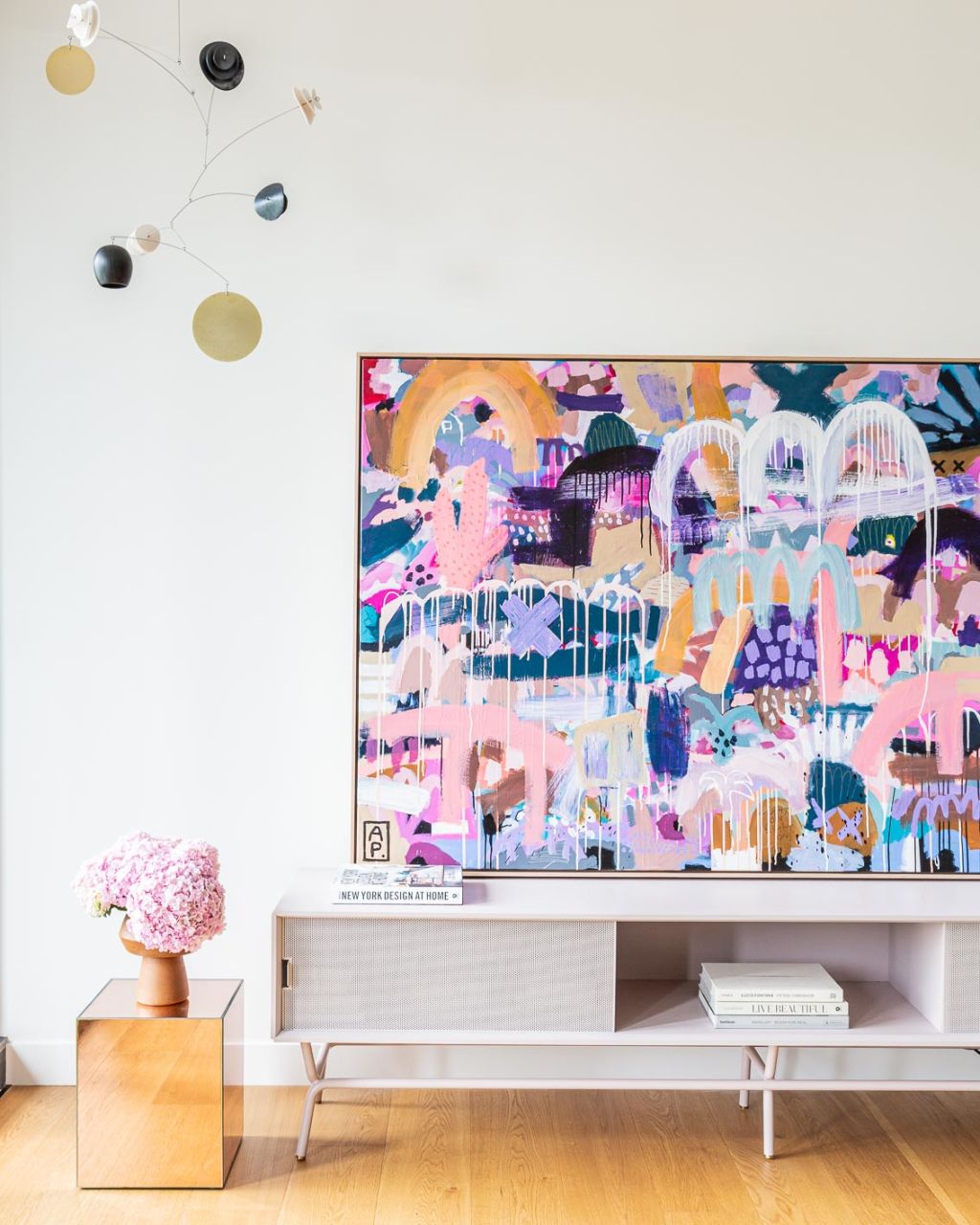 The bold artwork by Australian artist Anna Price takes pride of place in the living room. Photo: Chloe Lambert