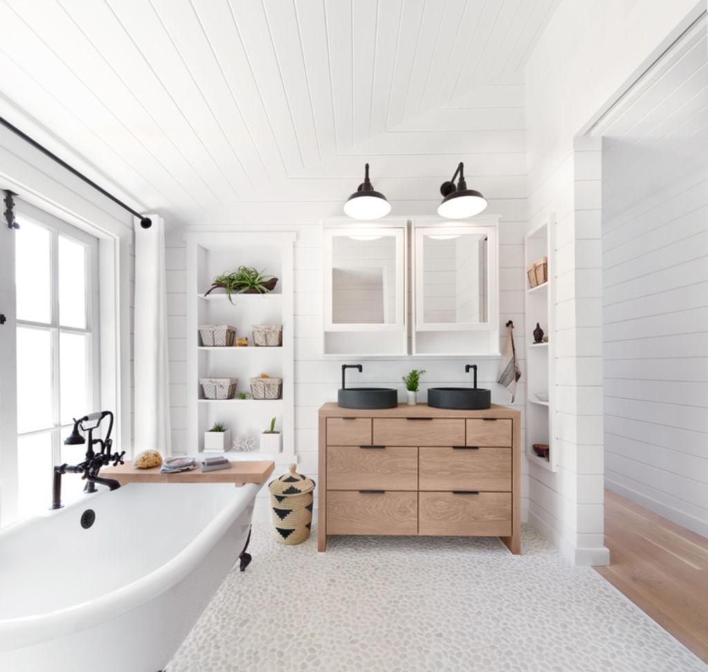 Allow for as much natural light as possible in your bathroom. Photo: Stocksy