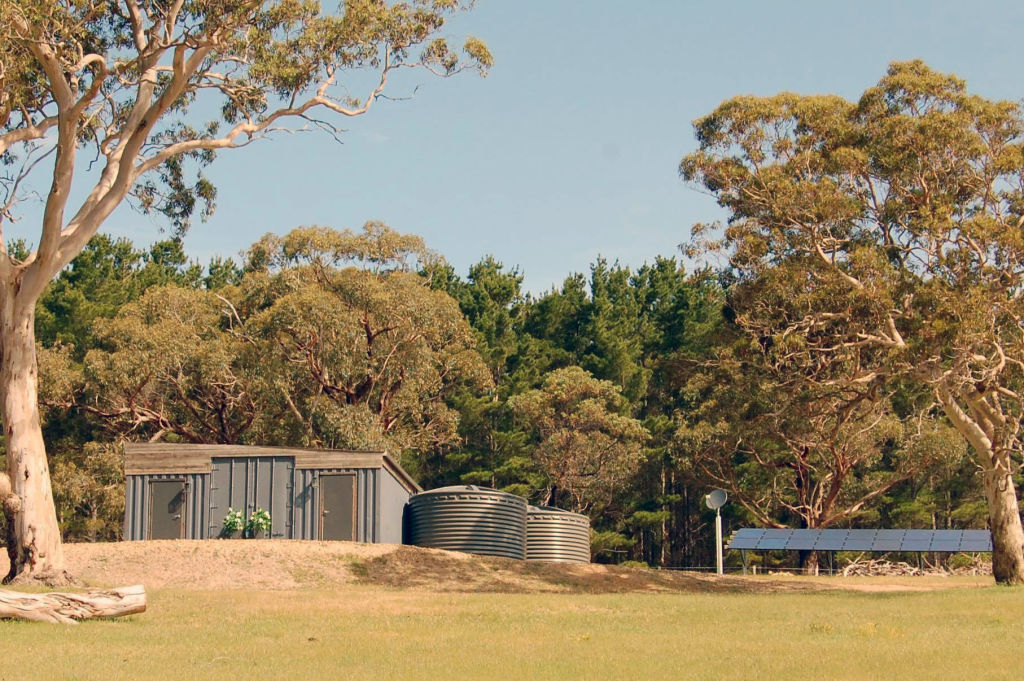 The home is powered by a ground-mounted solar system and battery storage. Photo: Supplied