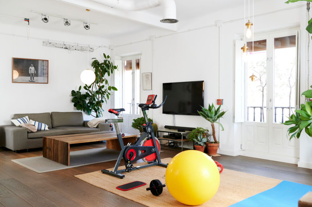 You had the best of intentions when purchasing that exercise bike, but it will soon be relegated to the garage. Photo: Stocksy