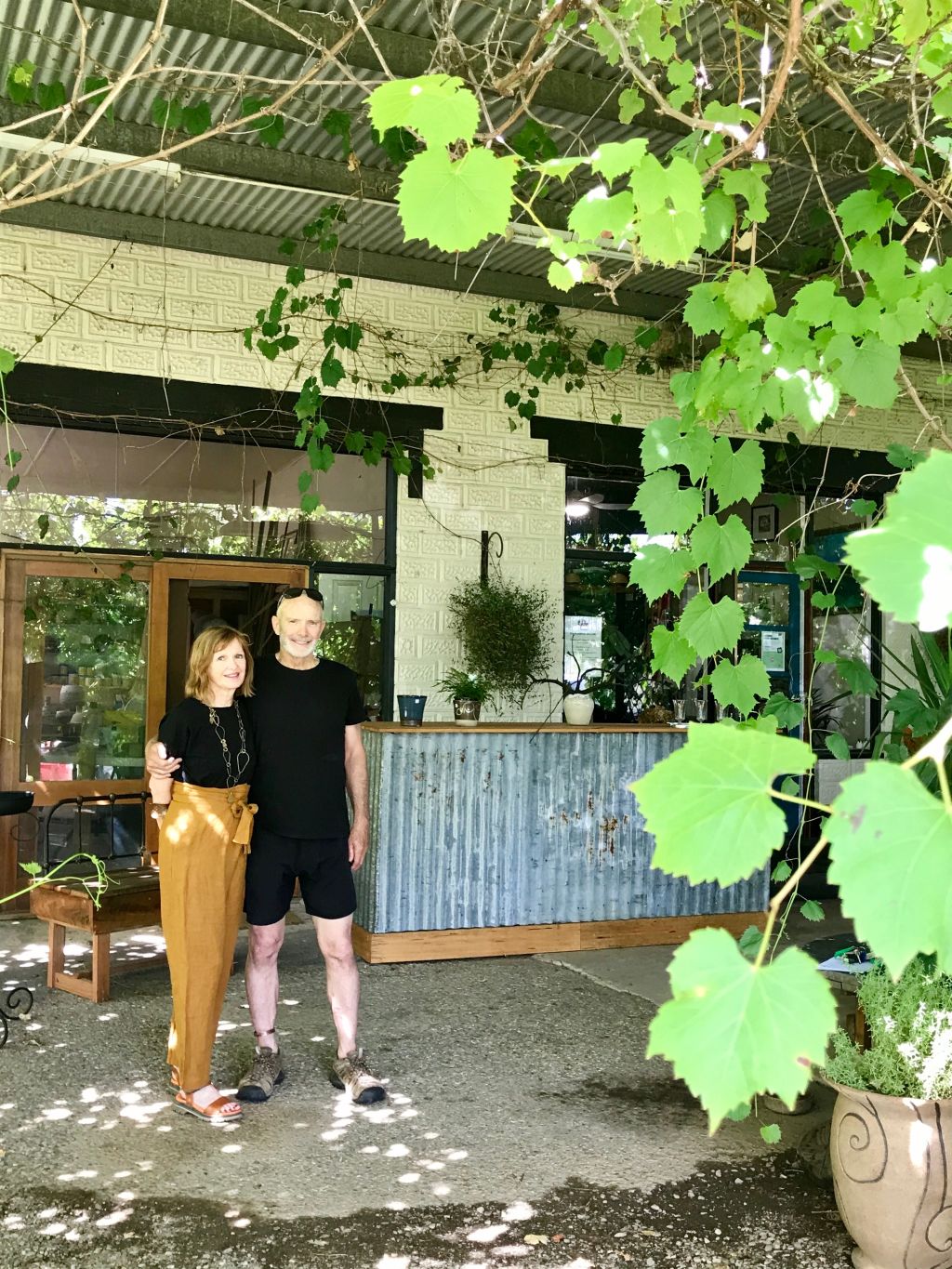 Trish Wimpenny and Brian Allen, in their converted Jugiong petrol station, believe the town will never become over commercialised. Photo: Jenny Brown