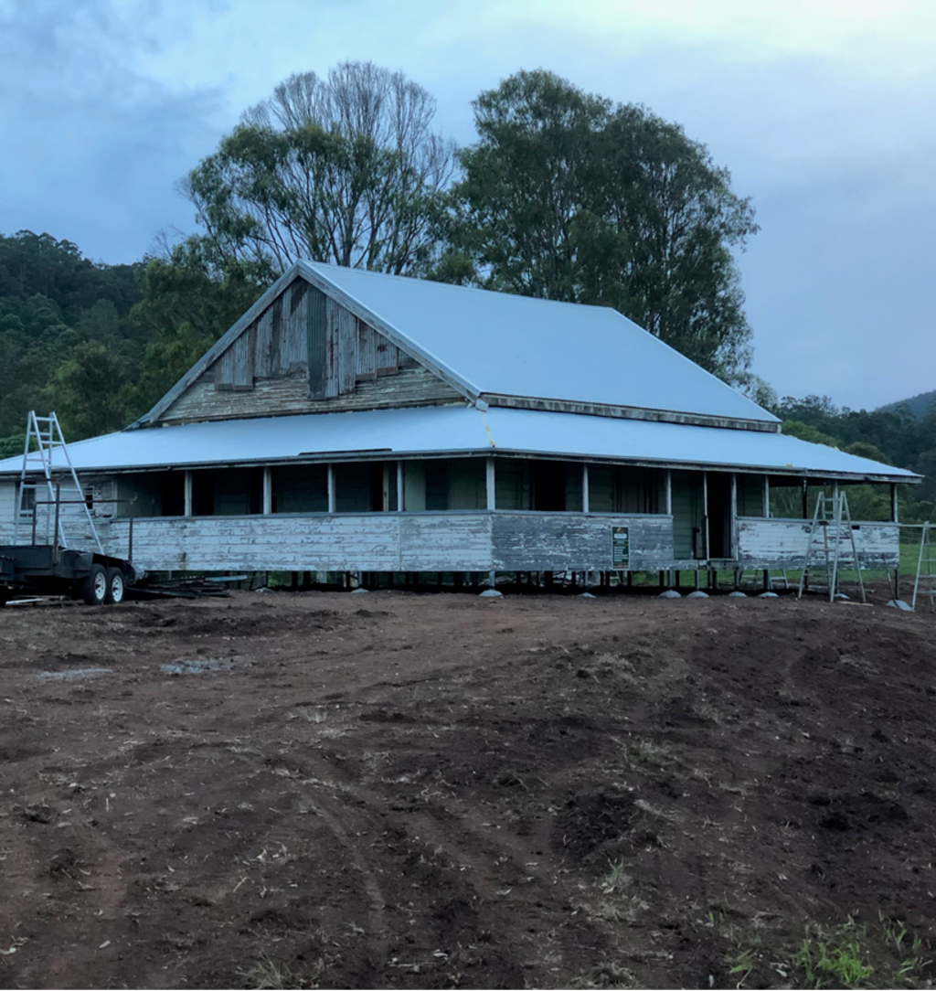 The 120-year-old farmhouse at its new location in Peachester before renovations began. Photo: Supplied