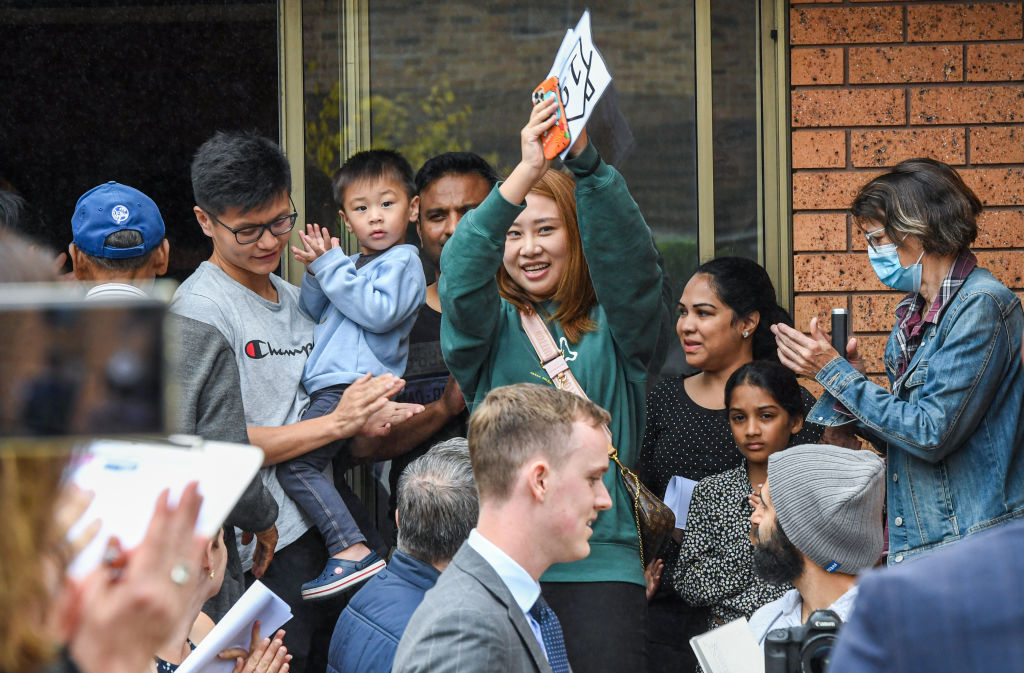 The winning bidder shows her excitement after placing the highest bid. Photo: Peter Rae