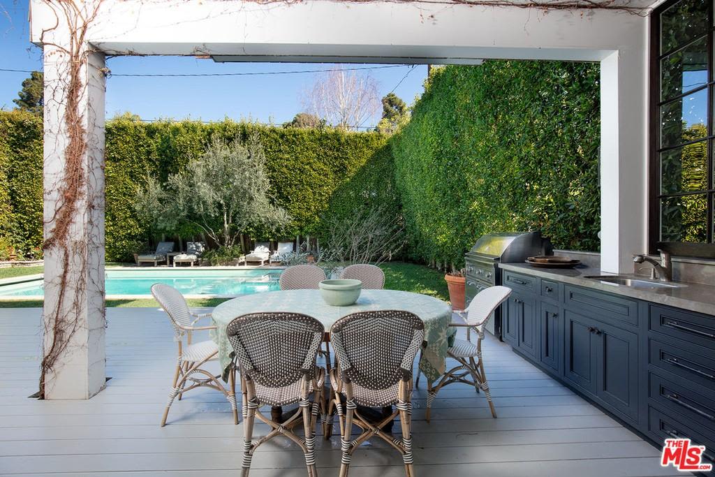 The home features outdoor entertaining and a pool. Photo: Realtor.com