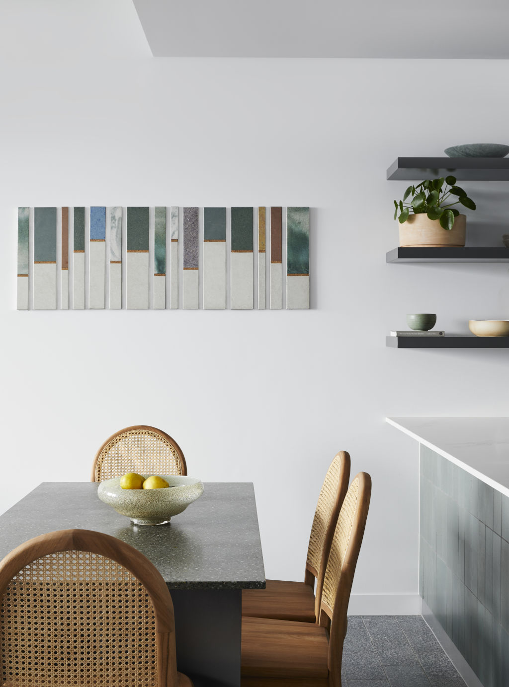An art work and dining table from green ceramics. Photo: Supplied