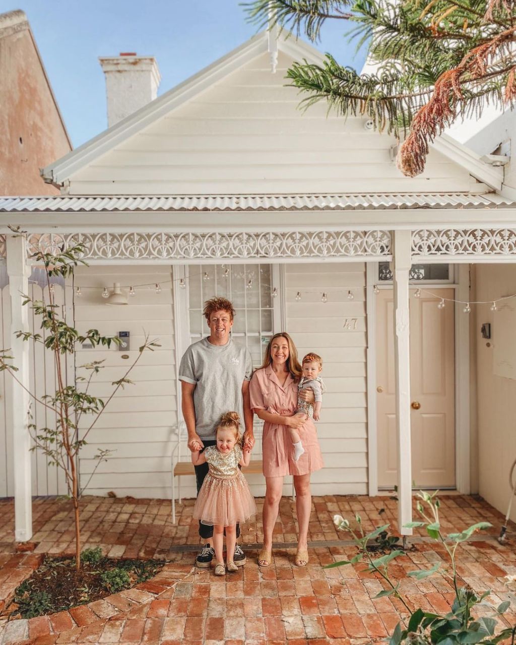 Josh and Jenna Densten with daughters Freddie and Story at their North Melbourne cottage. Photo: Instagram: @joshandjenna