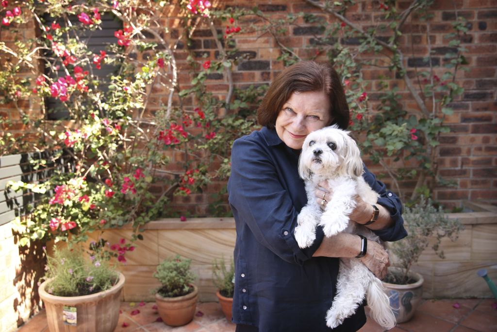 Robyn Vidler with her dog Lily at her Neutral Bay apartment which is a pet-friendly block Photo: James Alcock