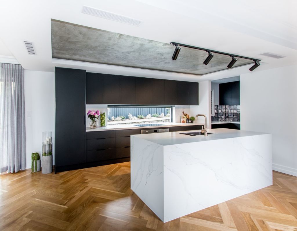 The kitchen today, sporting stunning herringbone timber floors. Photo: Harcourts Property Centre