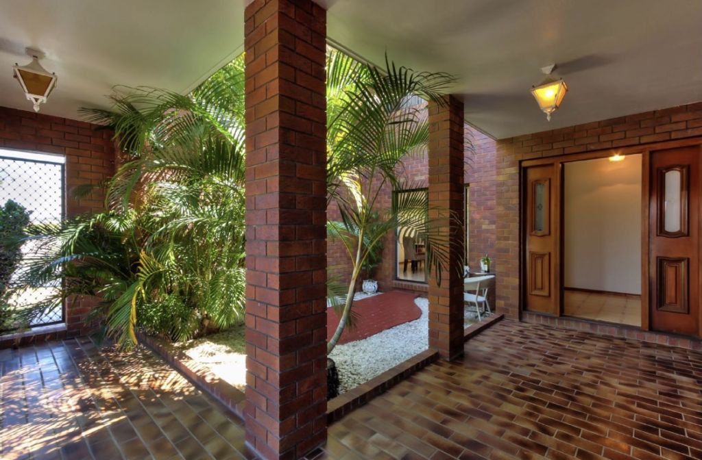 Tiles, bricks and concrete were big when this house was built. Photo: Supplied