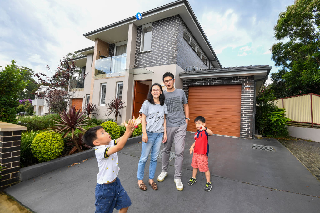 Jocelyn and Robert Zheng, with their two sons Justin and Ryan, are selling their North Ryde home at auction this Saturday. Photo: Peter Rae