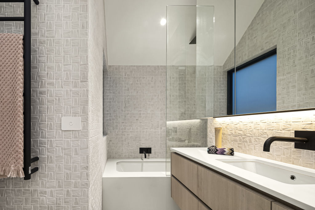 The bathroom with striking feature tiles.  Photo: Greg Hocking Holdsworth