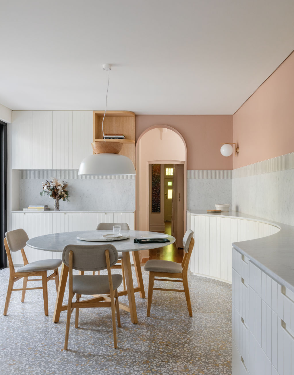 This kitchen has been designed to accommodate a beloved dining table. Photo: Katherine Lu