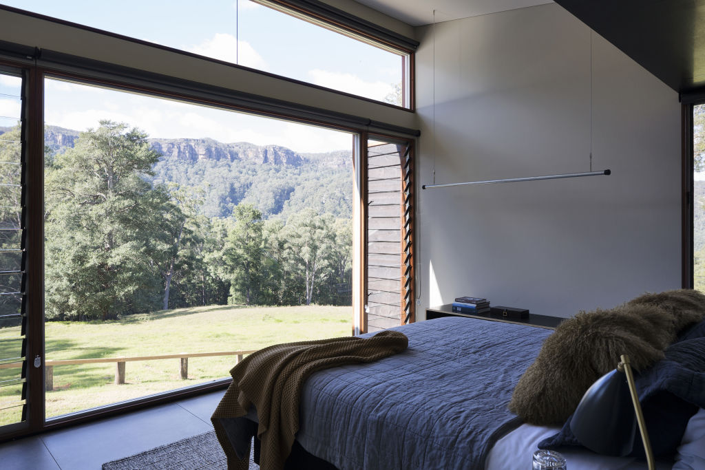 Enjoy the views out to sandstone cliffs from your bedroom. Photo: Simon Whitbread