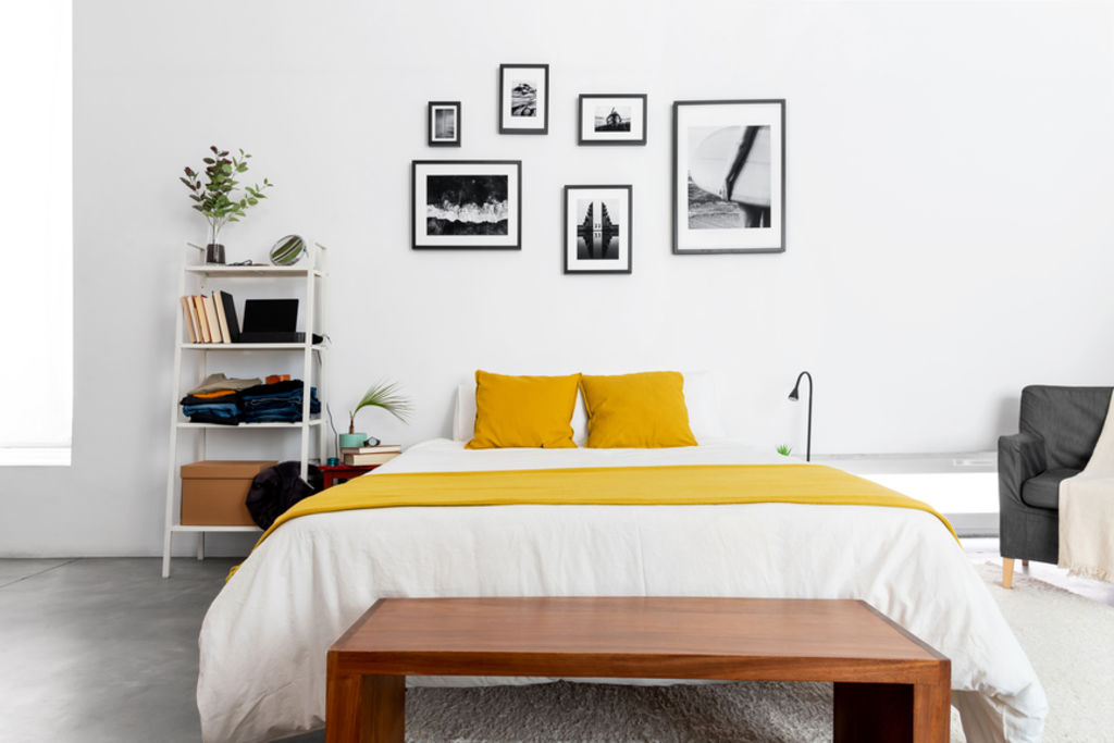 Mix and match different sizes and frame types for a more relaxed look. Photo: Stocksy