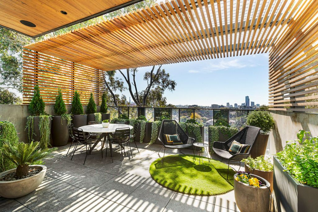 The five-storey St Kilda home boasts a rooftop bar, lounge and terrace with views of the city skyline and the bay.