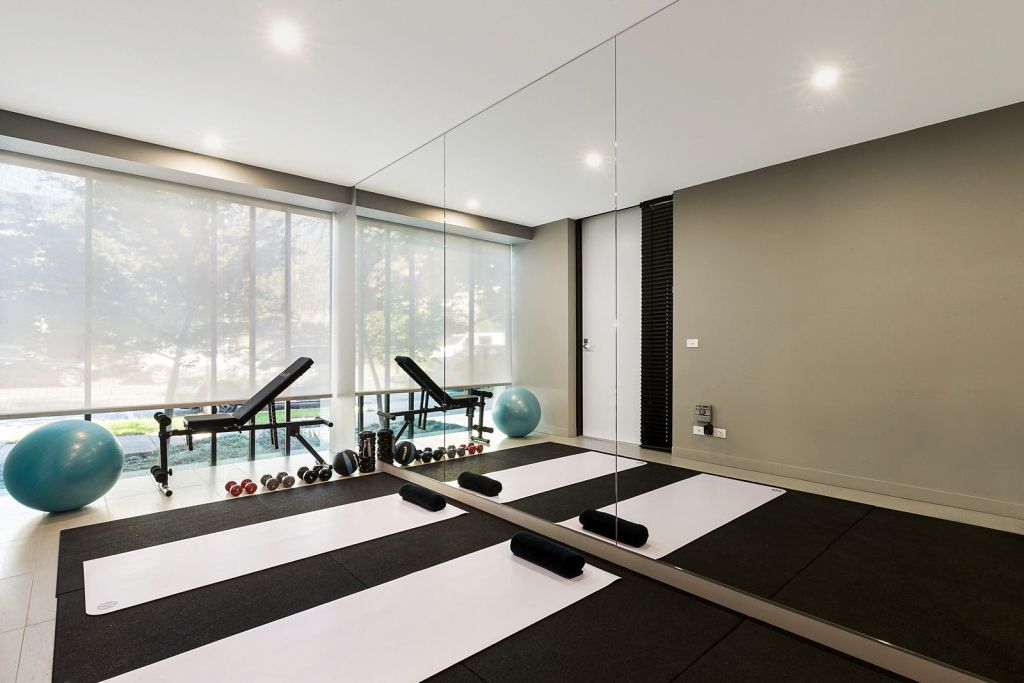 The owners turned the ground-floor commercial space into a private gym.