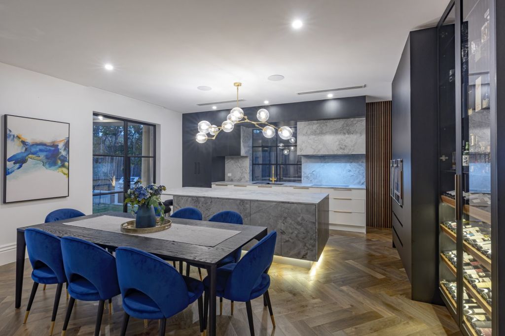 The owners of a Brighton mansion have given the home a stunning makeover, including herringbone floors and stone benchtops.