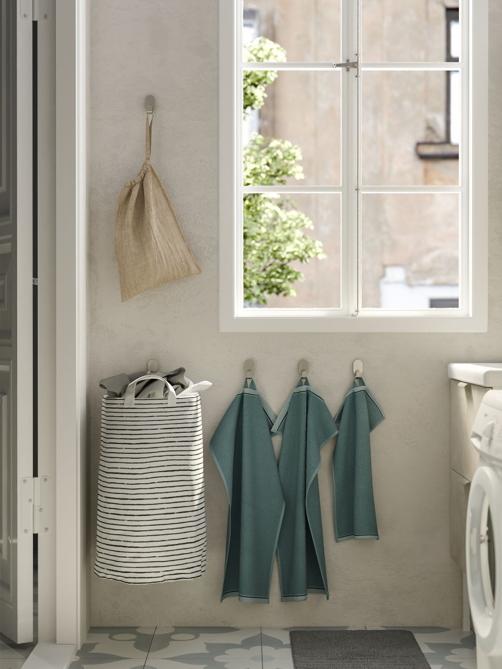 Hooks and holders will work wonders in a small laundry. Photo: Ikea