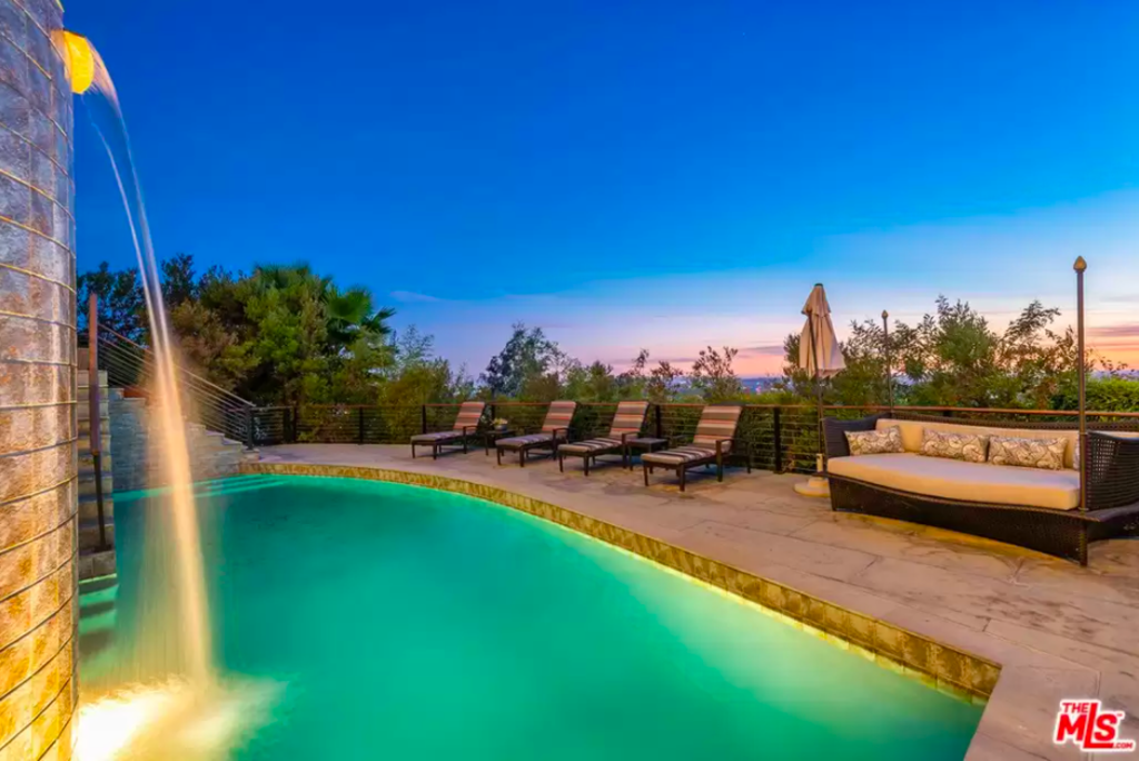 It features a pool and spa with waterfall. Photo: Realtor.com