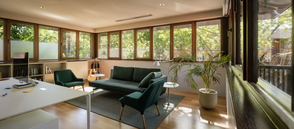His study is a new room up in the trees, with furnishings and colour by Nexus Designs. Photo: Trevor Mein