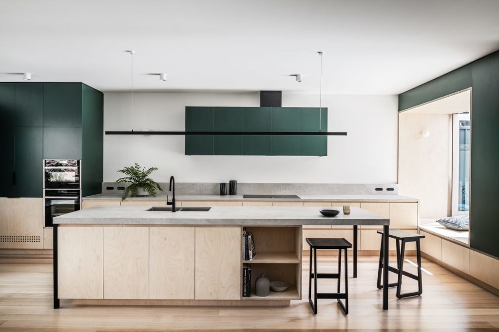 Teal-toned interiors and a deep window seat in a stunning kitchen. Photo: Tom Blachford