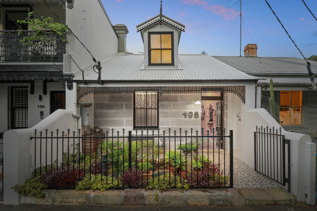 This Alexandria home utilises both new and recycled sandstone as the foundation for the entry's exterior. Photo: Supplied