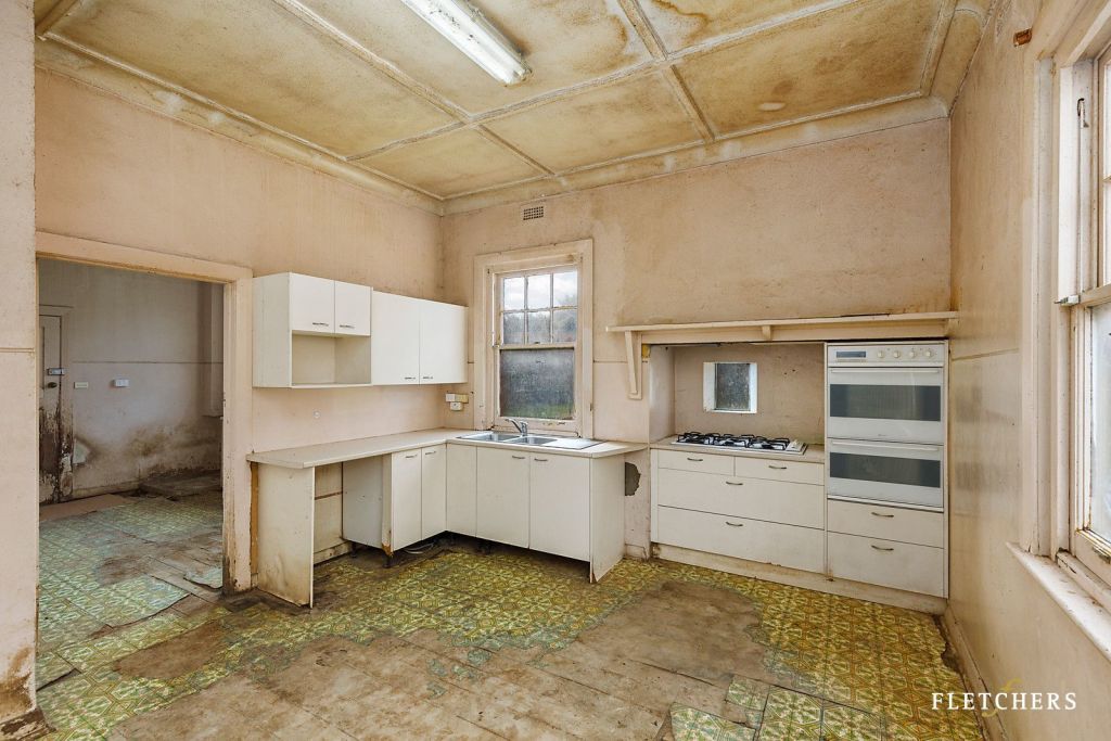 This Melbourne house with a derelict kitchen and bathroom has sold for $7.24m