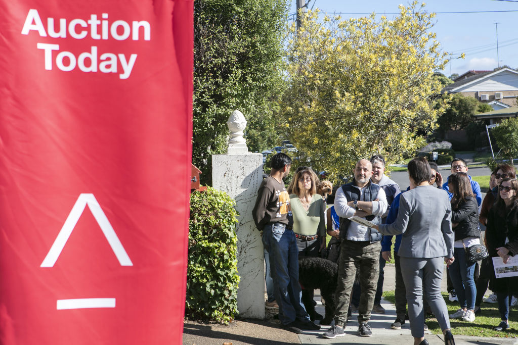 With house prices in many capital cities rising fast, auctions are becoming increasingly emotion charged as buyers fear they will miss out. Photo: Stephen McKenzie