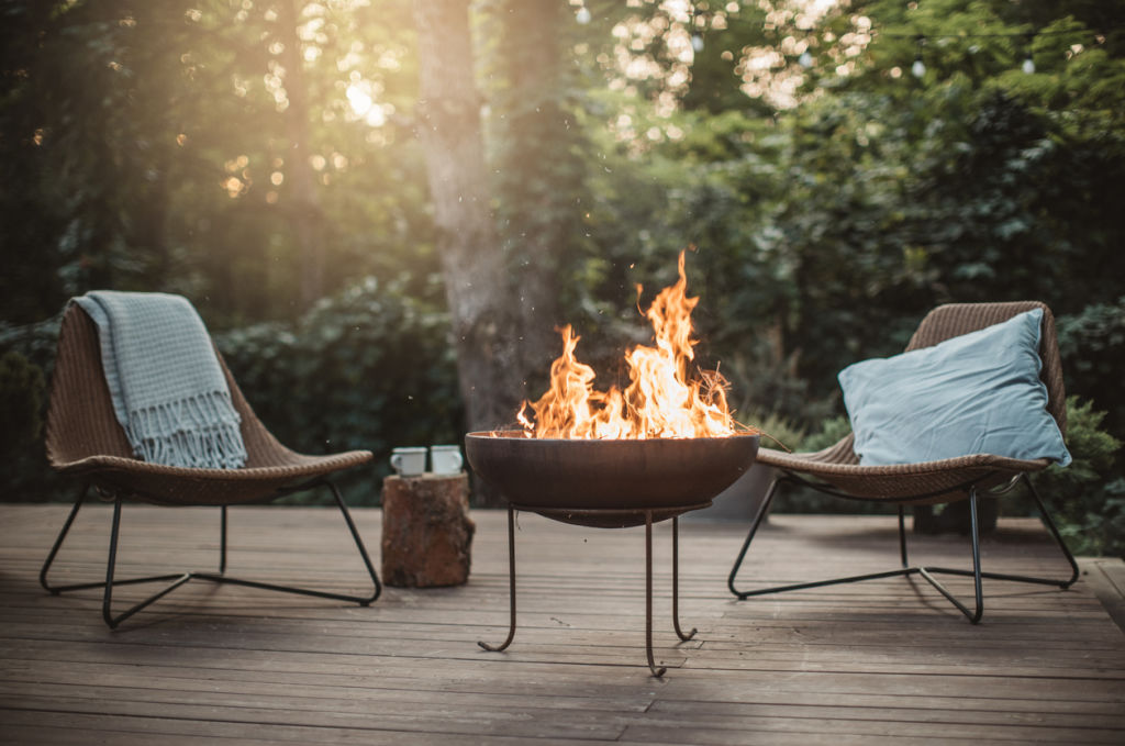 Wood-fired fire pits tend to throw out more heat. Photo: iStock