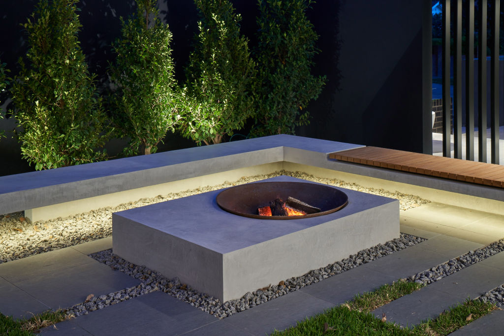 This built-in fire pit by Mint Landscape Design doubles as a table. Photo: Mint Landscape Design