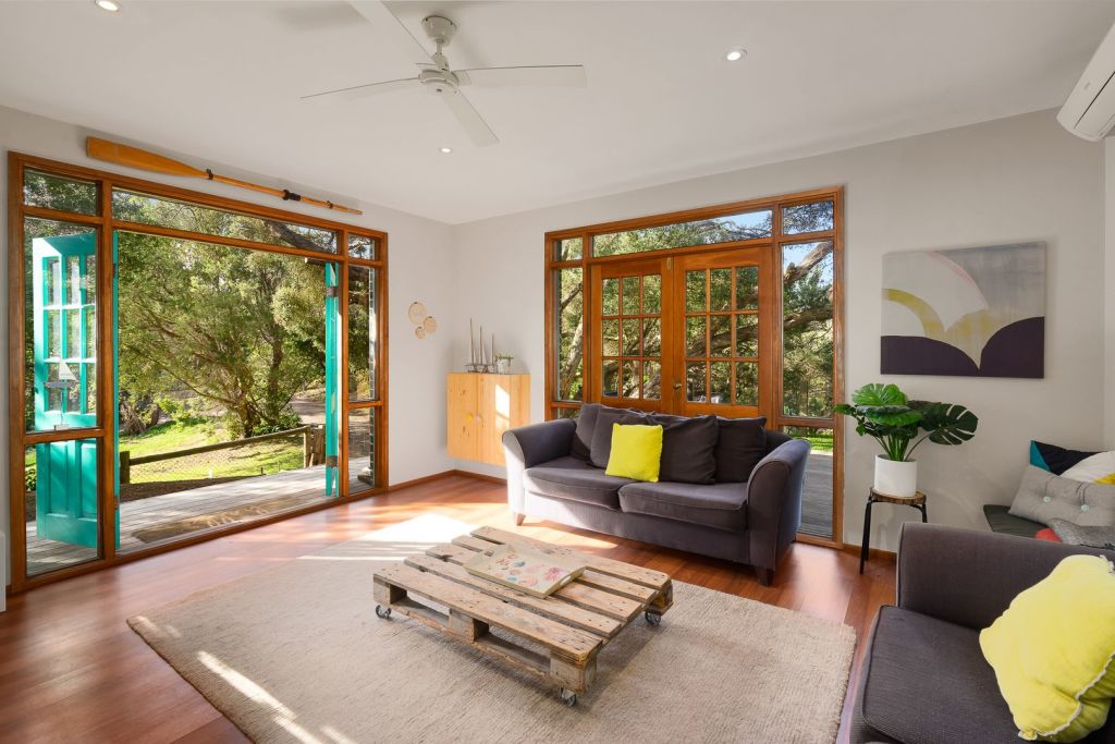 Quirky furniture inside the home included a coffee table made from wooden pallets. Photo: Home AU Real Estate