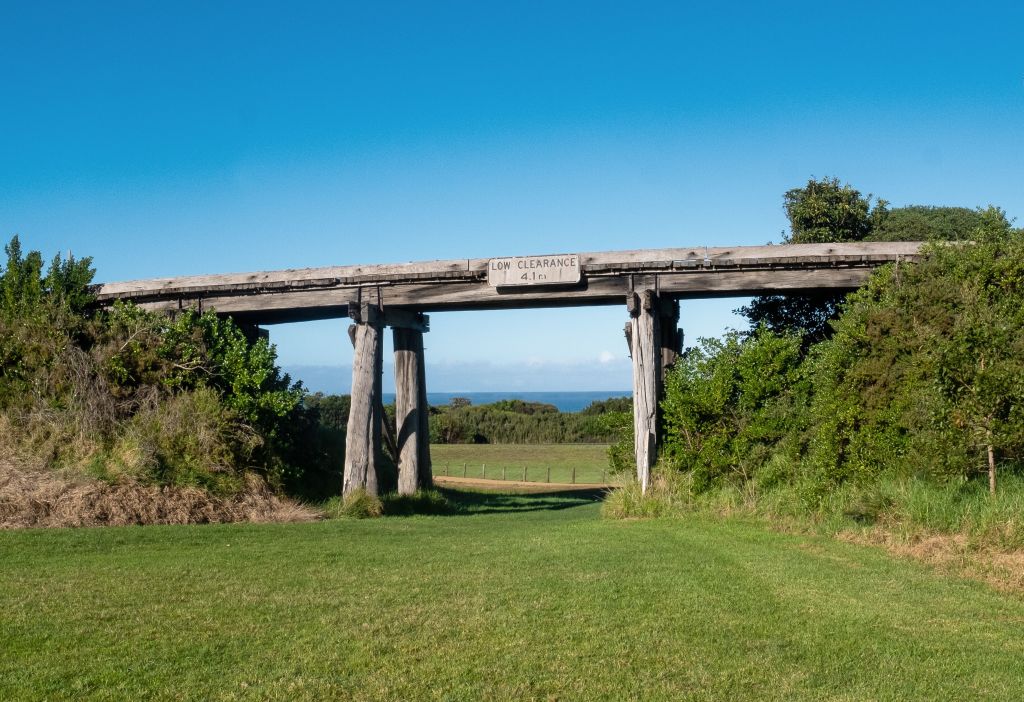 Now a rail trail, the old trestle bridge gives the house a keyhole look at Bass Strait. Photo: Jenna Russo